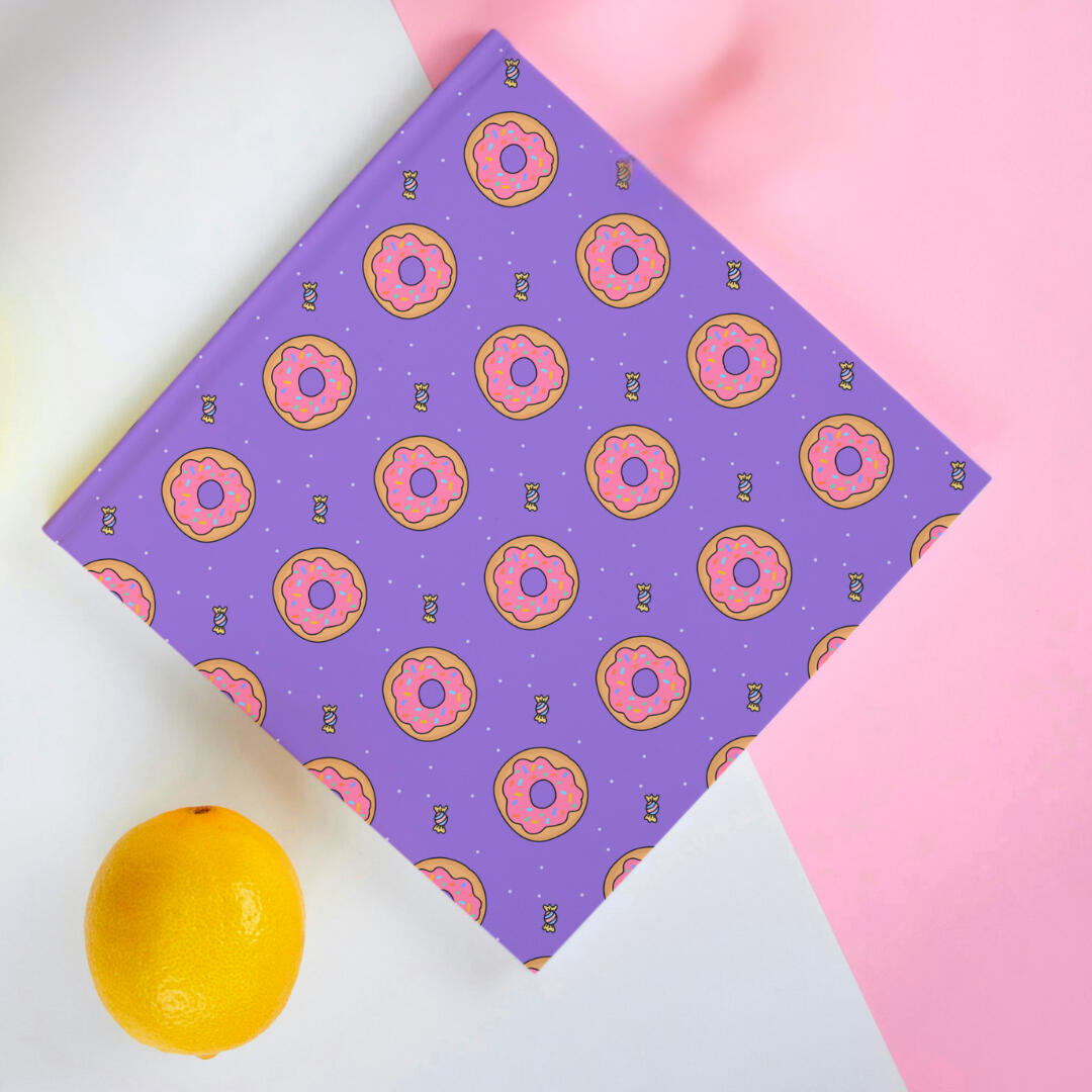 Delicious donut pattern with a cheeky sweet in the corner and dustings of sugar - Yemisi Olusanya